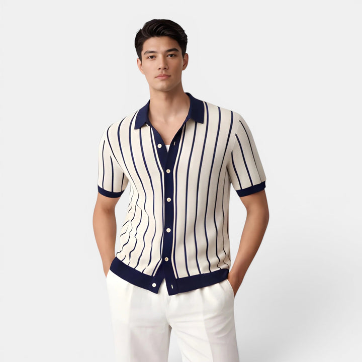 Male model wearing a striped knit polo shirt against a plain background.