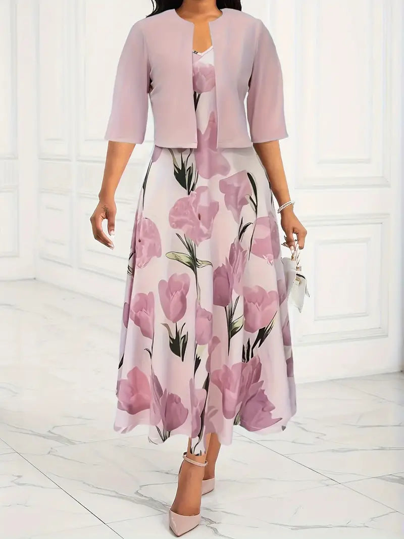 Female wearing a floral maxi dress with a matching cropped jacket on a plain background.