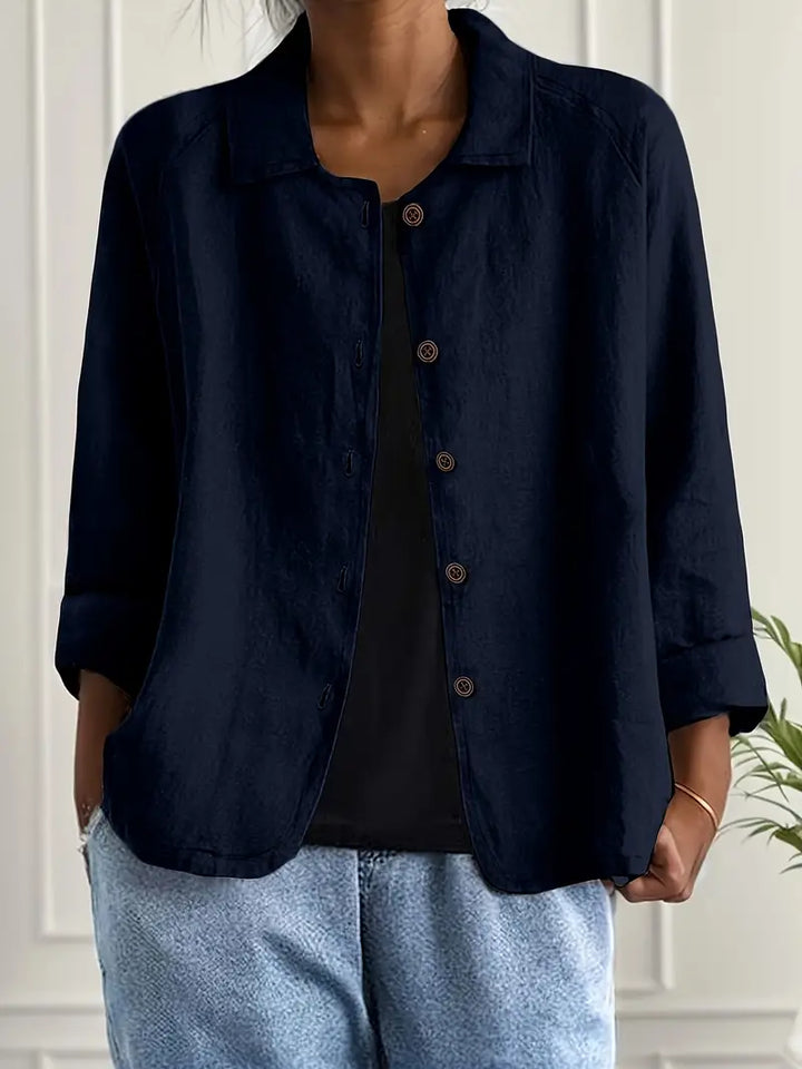 Woman in a refined lightweight top on a clean background with graceful movement.
