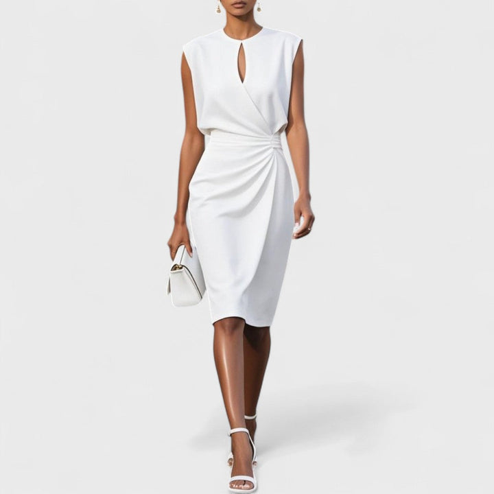 Elegant women’s dress with model on a plain background.