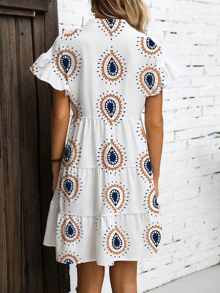 Lightweight flowy midi dress with relaxed boho-inspired design on brick wooden backdrop, back view