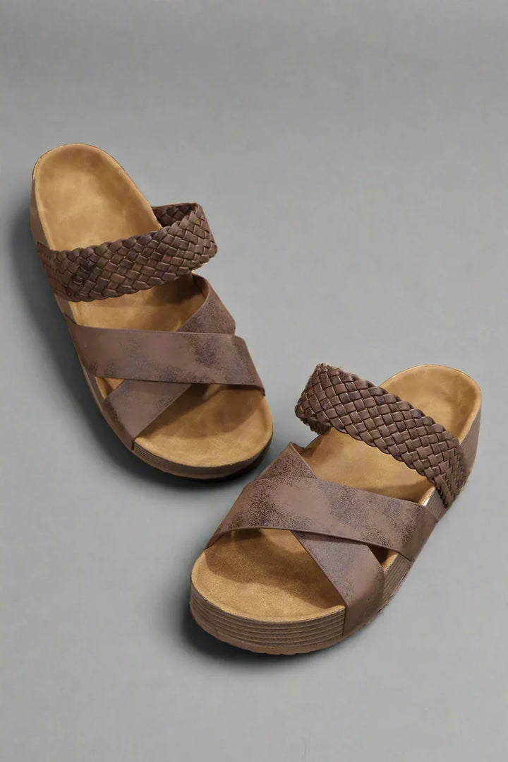 Foot displayed in lightweight comfort sandal on clean background.