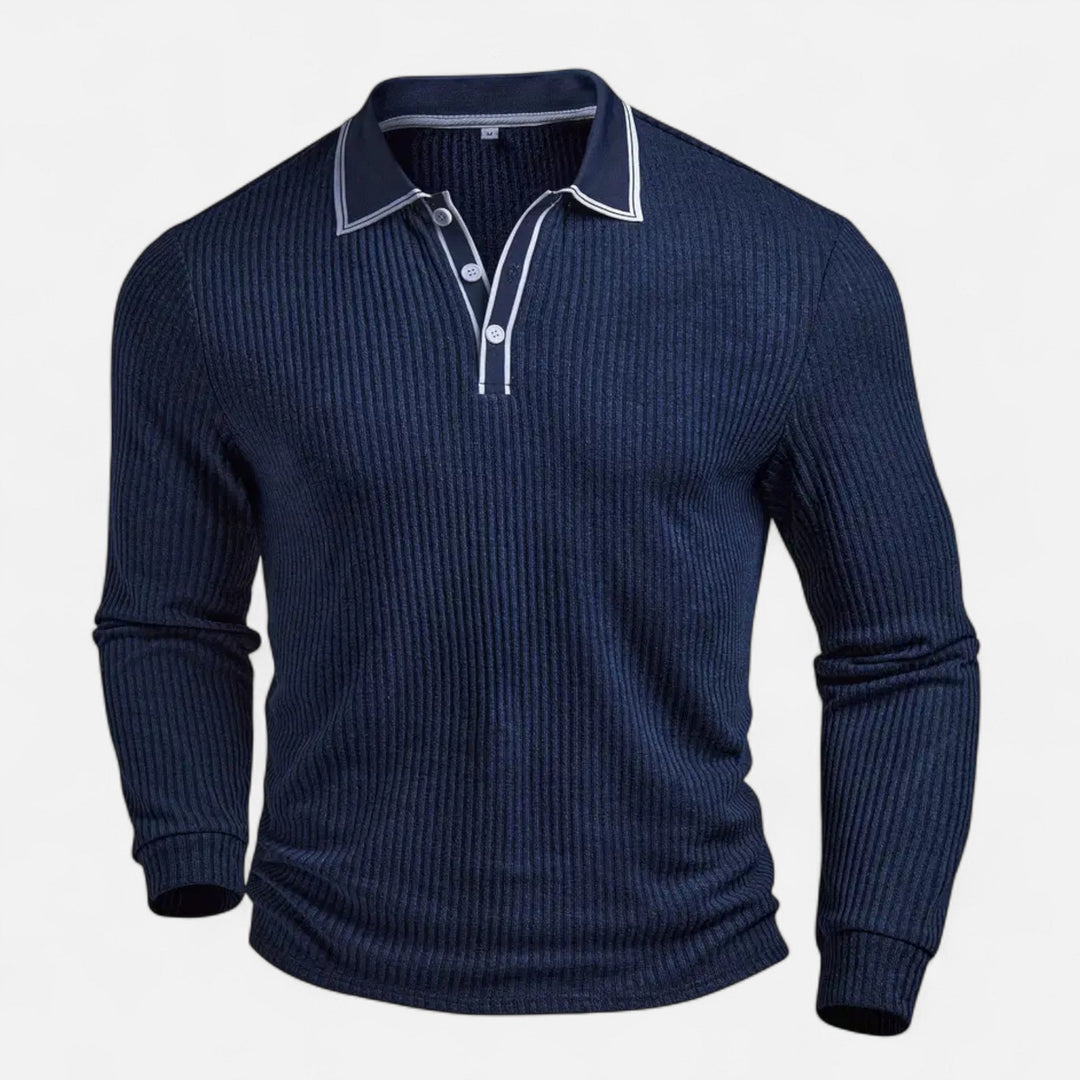  Male model dressed in a navy button-front shirt with long sleeves and contrast trim against a plain background.