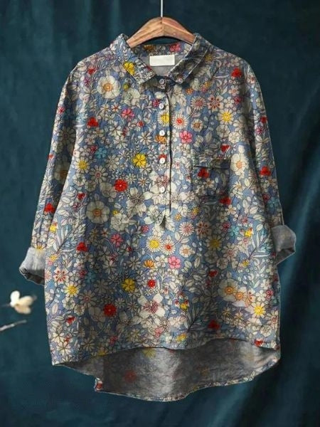 Flattering floral blouse against a clean background.