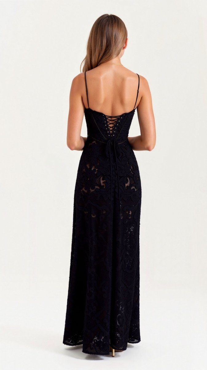 Female wearing a floral floor-length dress with delicate shoulder straps against a plain background.
