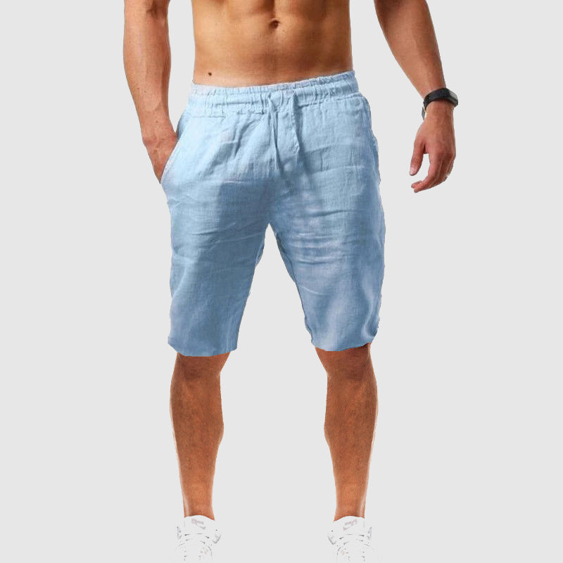 
Woman modeling relaxed summer shorts with pockets on a plain background.