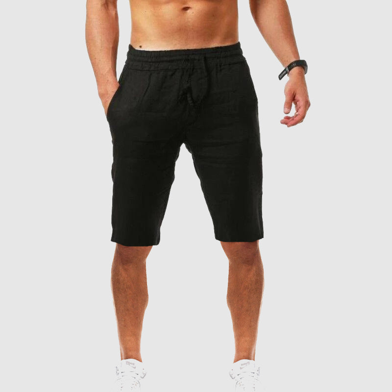  Female model showing drawstring waist casual shorts on a plain background.