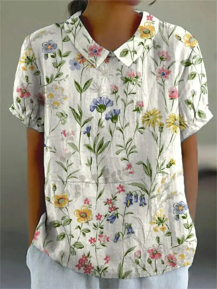 Elegant floral shirt for women shown against a clean background.