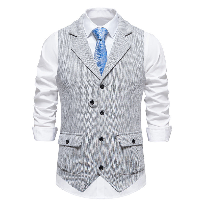 Front view in tailored formal vest, gray background.