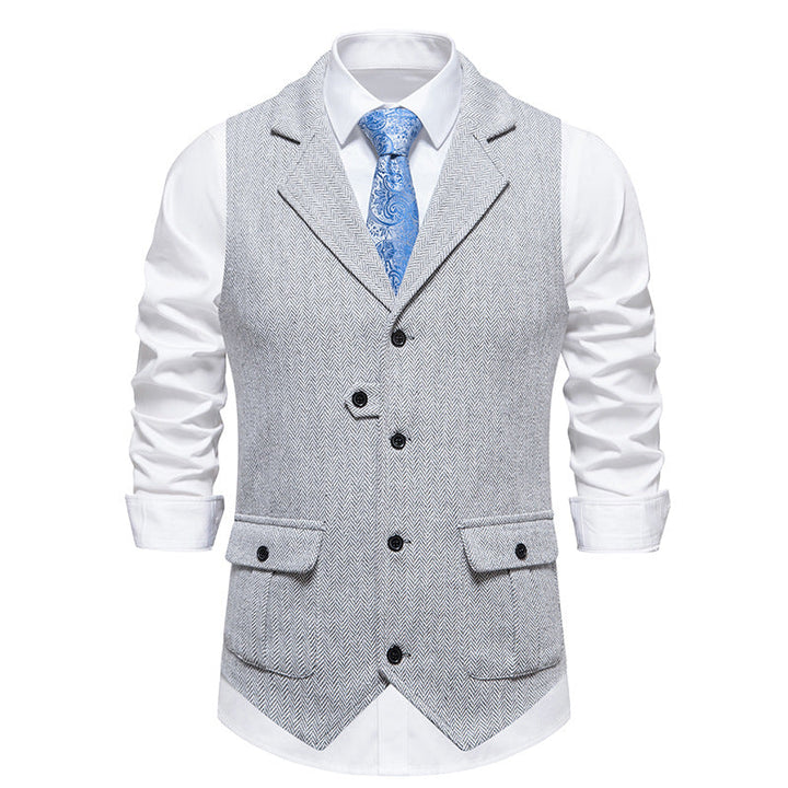 Front view in tailored formal vest, gray background.