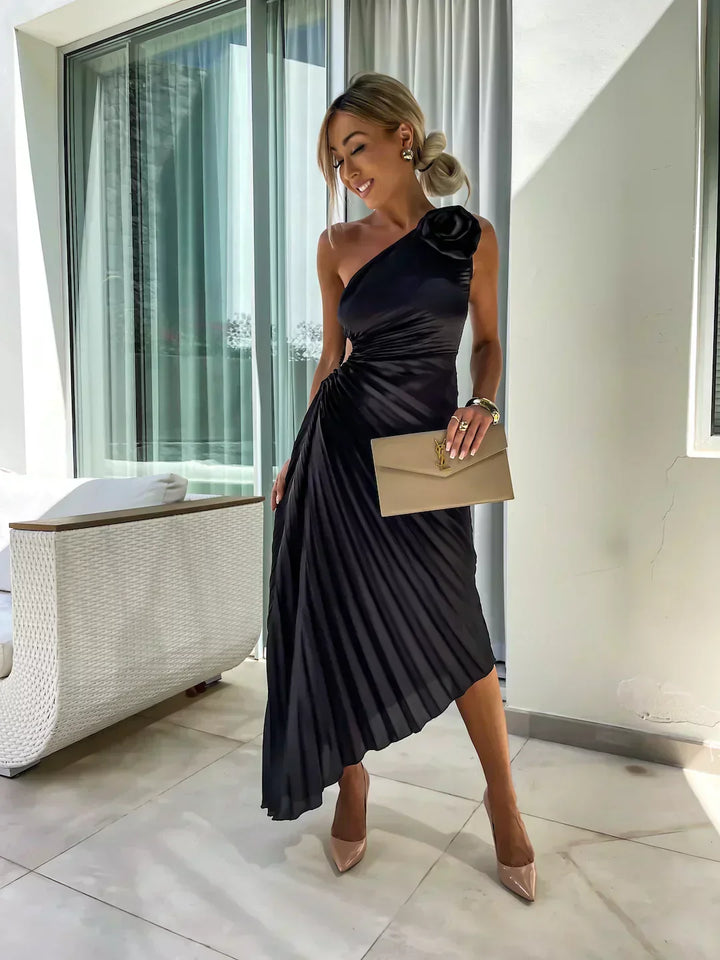 Woman showcasing a romantic floral fashion look with flowing fabric details.
