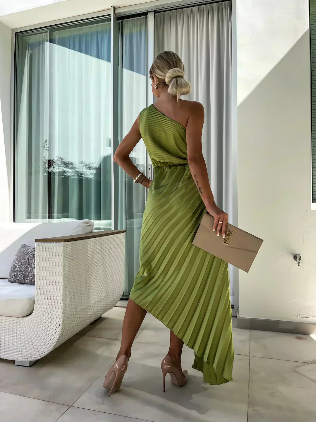 Female model wearing a lightweight floral midi dress with soft movement.