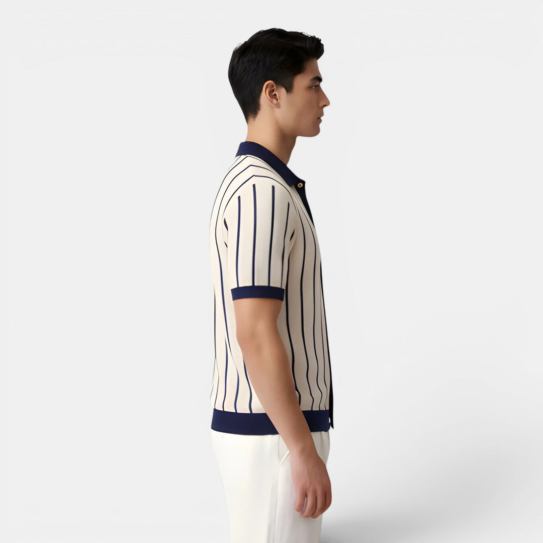  Man wearing a classic striped polo shirt with a relaxed fit on a plain background.