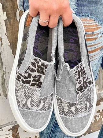 Women’s cushioned slip-on shoes worn by a female model on plain background.