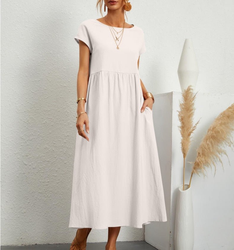  Woman standing in a flowing maxi dress  
