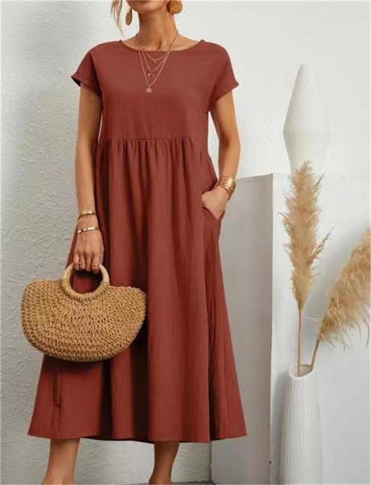 Woman wearing a lightweight maxi dress styled for everyday fashion on a plain background.