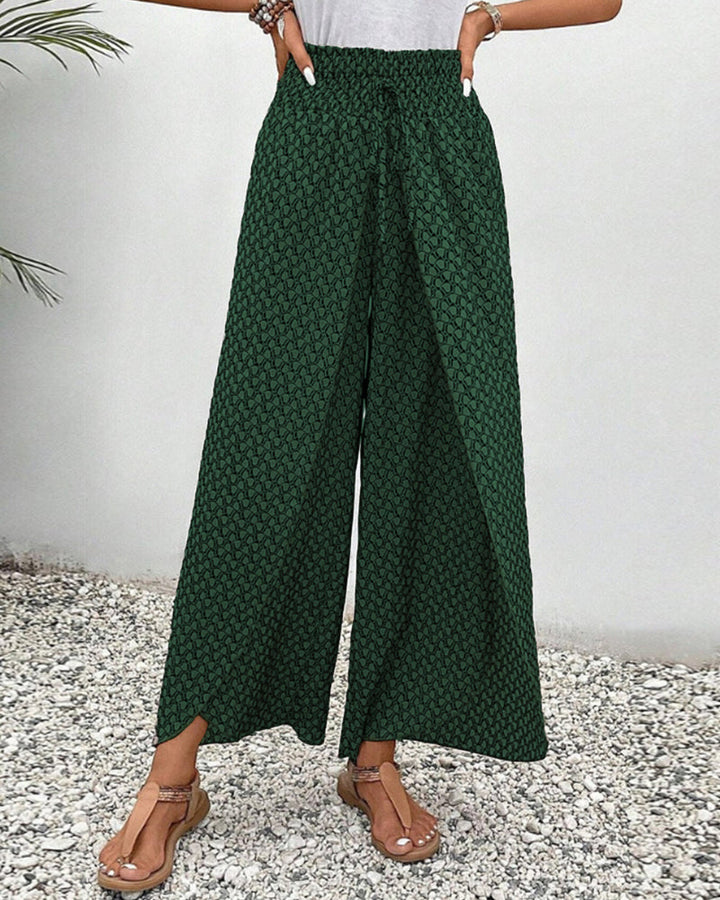Women’s flowing trousers displayed on a clean plain background.