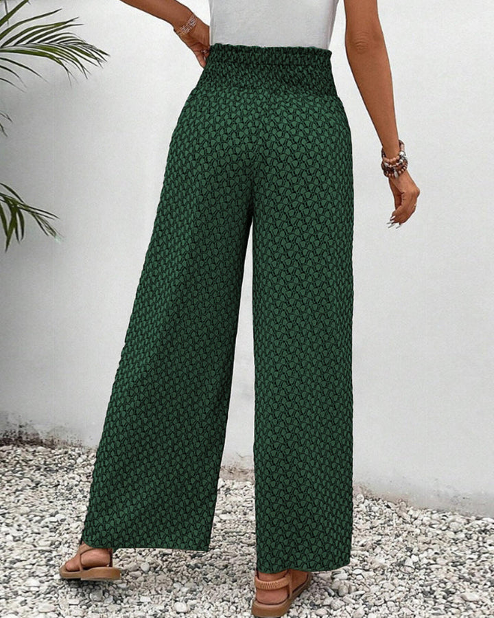 Wide-leg trousers with easy movement shown on a plain background.