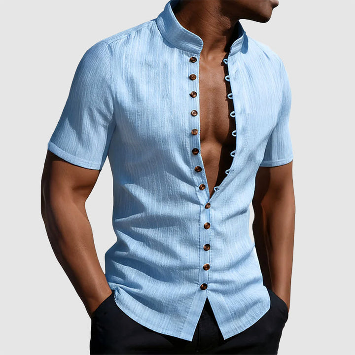 Male model in a modern mandarin collar shirt against a plain background.
