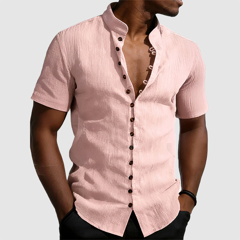  Model wearing a clean button-front shirt with mandarin collar detail.