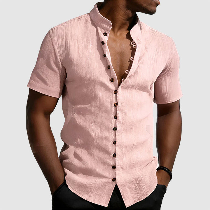 Model wearing a clean button-front shirt with mandarin collar detail.
