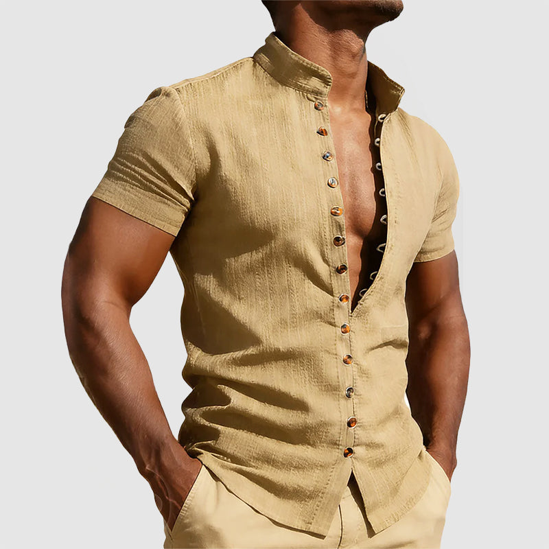  Male model showcasing a tailored mandarin collar shirt on a plain background.