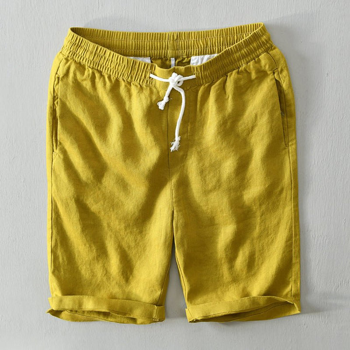  Male model wearing lightweight casual shorts with an adjustable waist on a plain background.