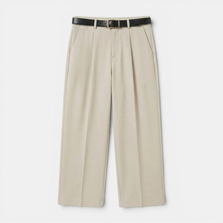 Ppleated tailored trousers for a polished appearance on a plain background.