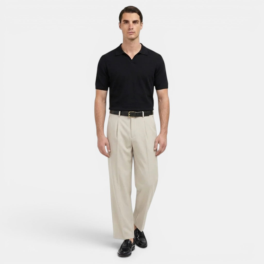  Male model standing in straight leg tailored trousers on a plain background.