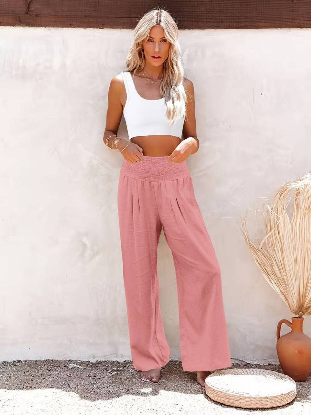 High waist wide leg pants with clean front pleats and relaxed shape.