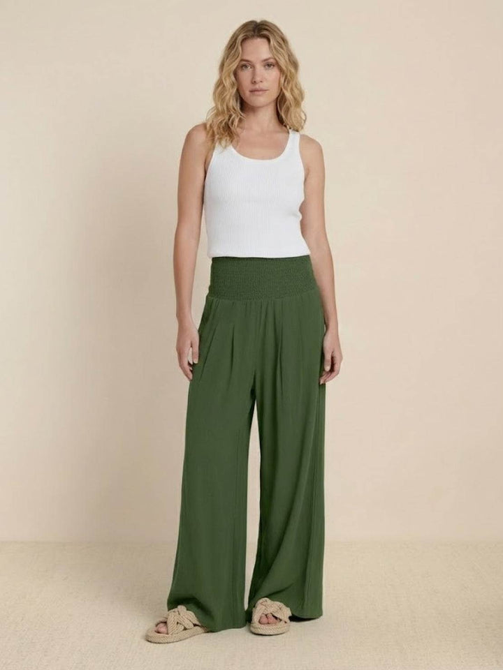 Plain background view of wide leg pants with high gathered waist.