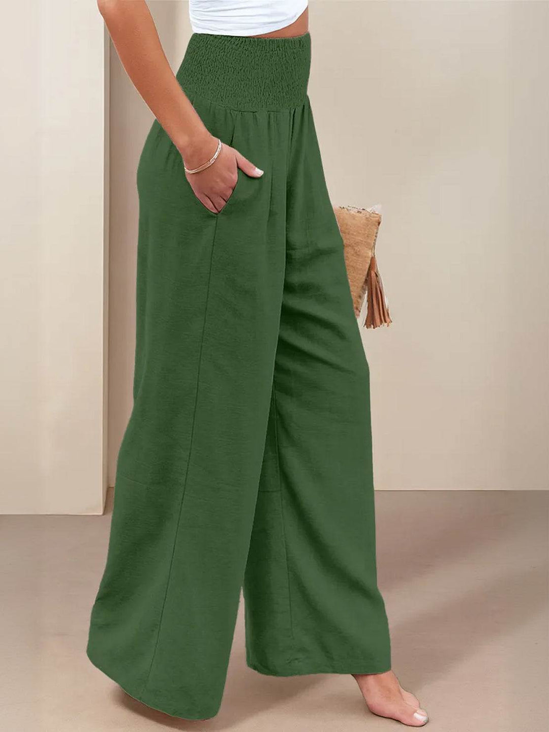 Women’s smocked waist pants with relaxed wide leg design.