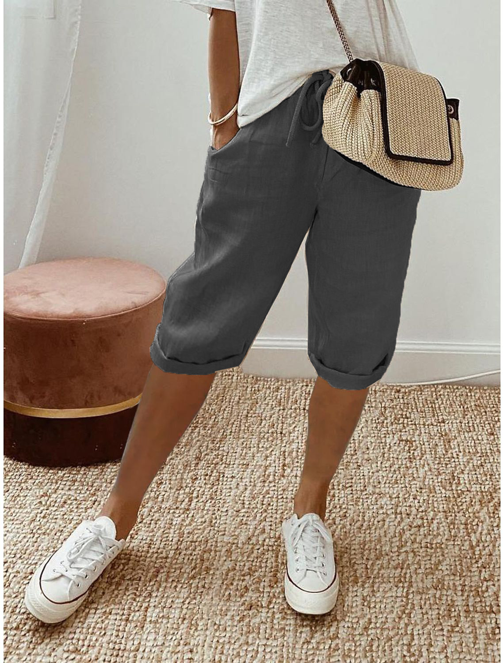 Breathable women’s capri pants shown on a beige background for everyday casual wear.