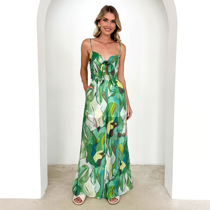 Women’s long printed suspender strap dress with a flowing silhouette for stylish outings.