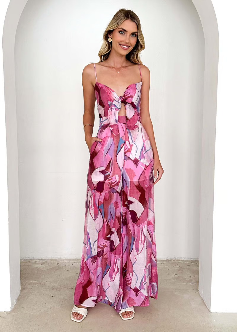 Elegant long printed dress with slim straps and a breezy seasonal look.