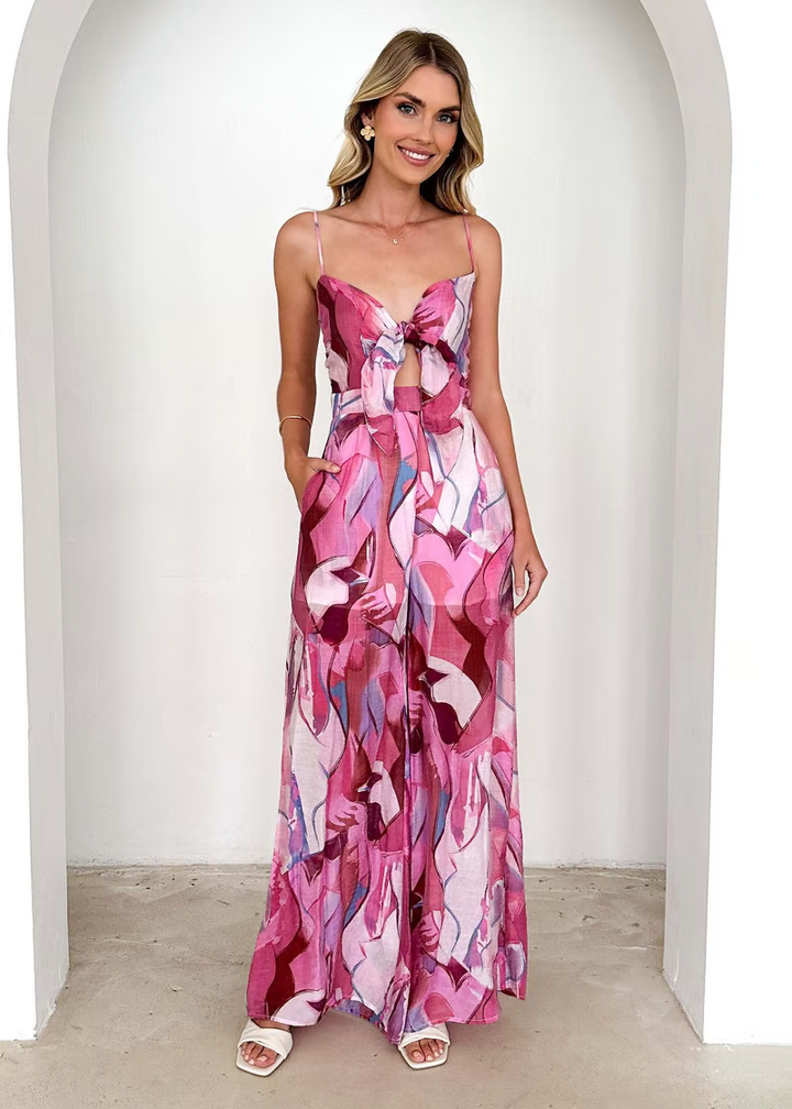 Elegant long printed dress with slim straps and a breezy seasonal look.