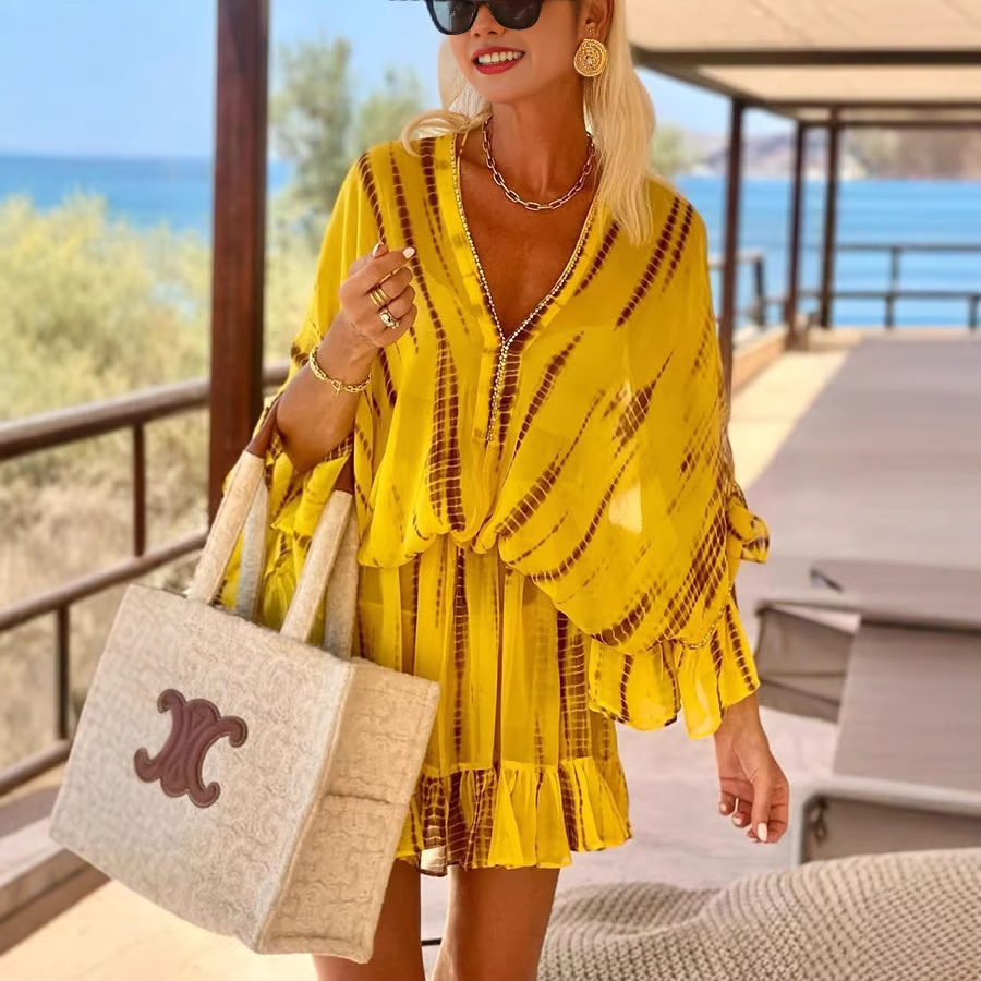 Elegant mini dress with V-neckline and flattering high waist for day-to-night wear