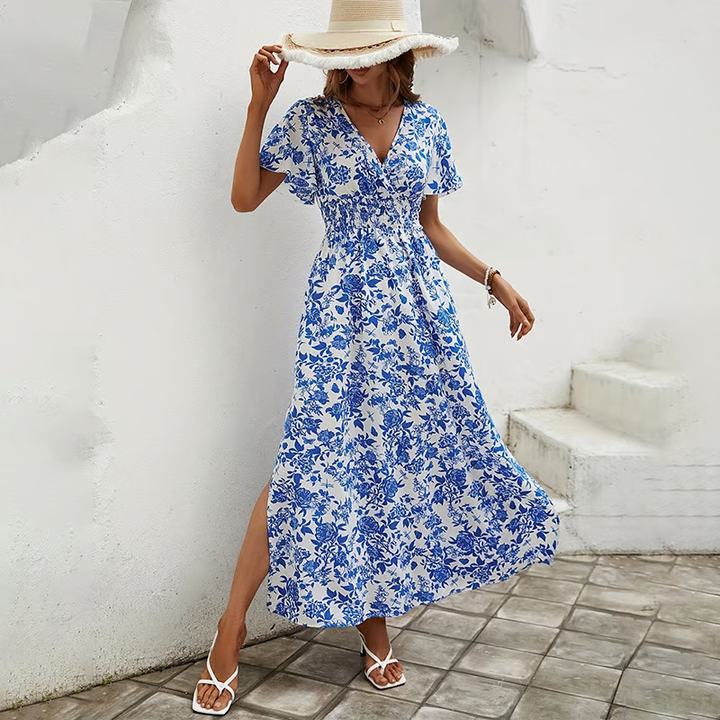 Blue bohemian beach dress with flowing silhouette for sunny seaside style.