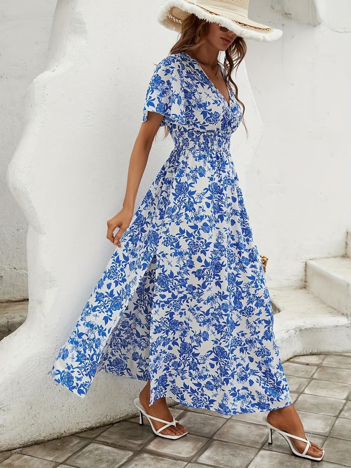 Blue patterned beach dress styled for sunny walks and summer travel.