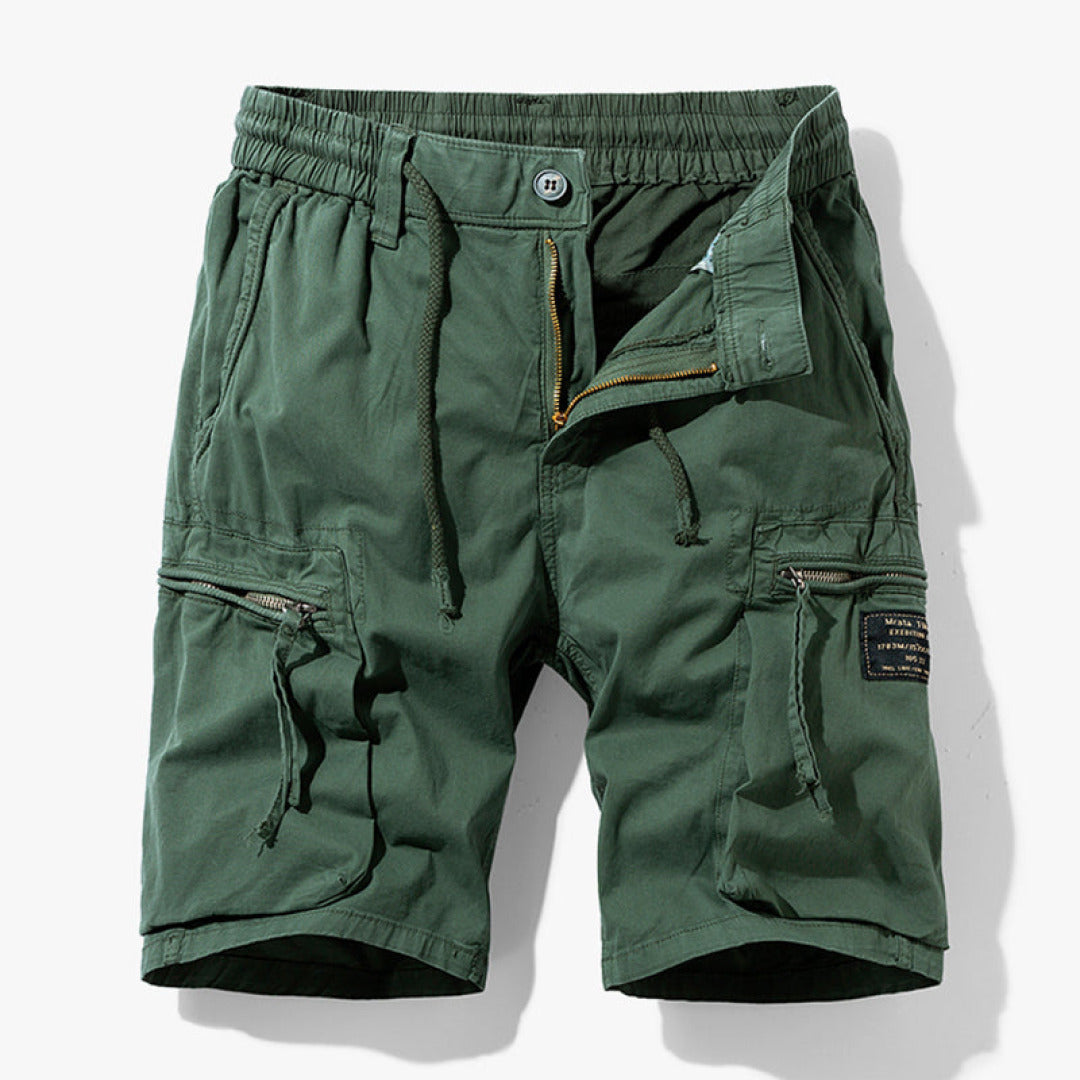 Cargo shorts for men with functional pockets on a plain background.