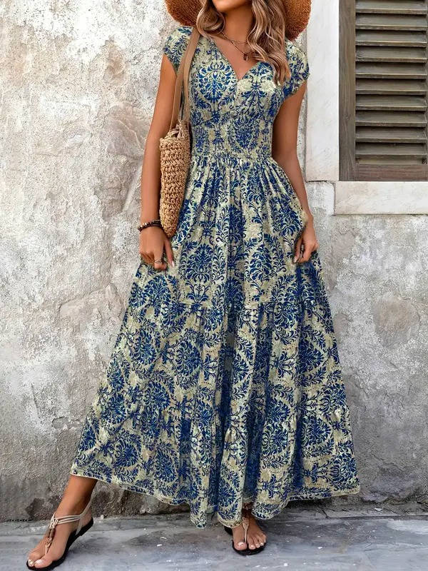Long printed dress with smocked waist shown on a female model