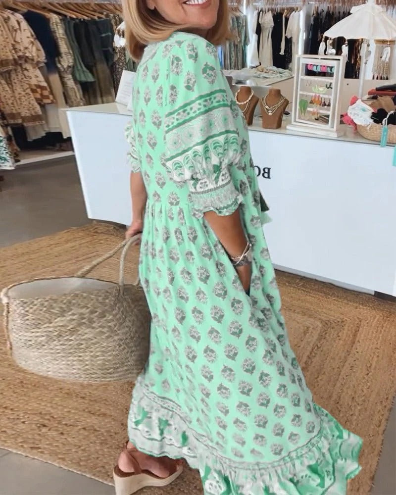 Flattering boho dress displayed on a plain background with flowing lines and casual charm.