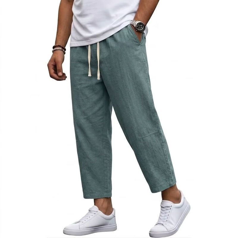  Male model wearing lightweight casual pants against a plain background.