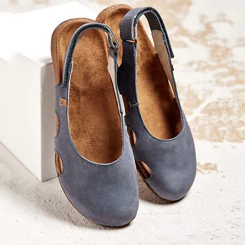 Cushioned daily wear sandals with heel strap.