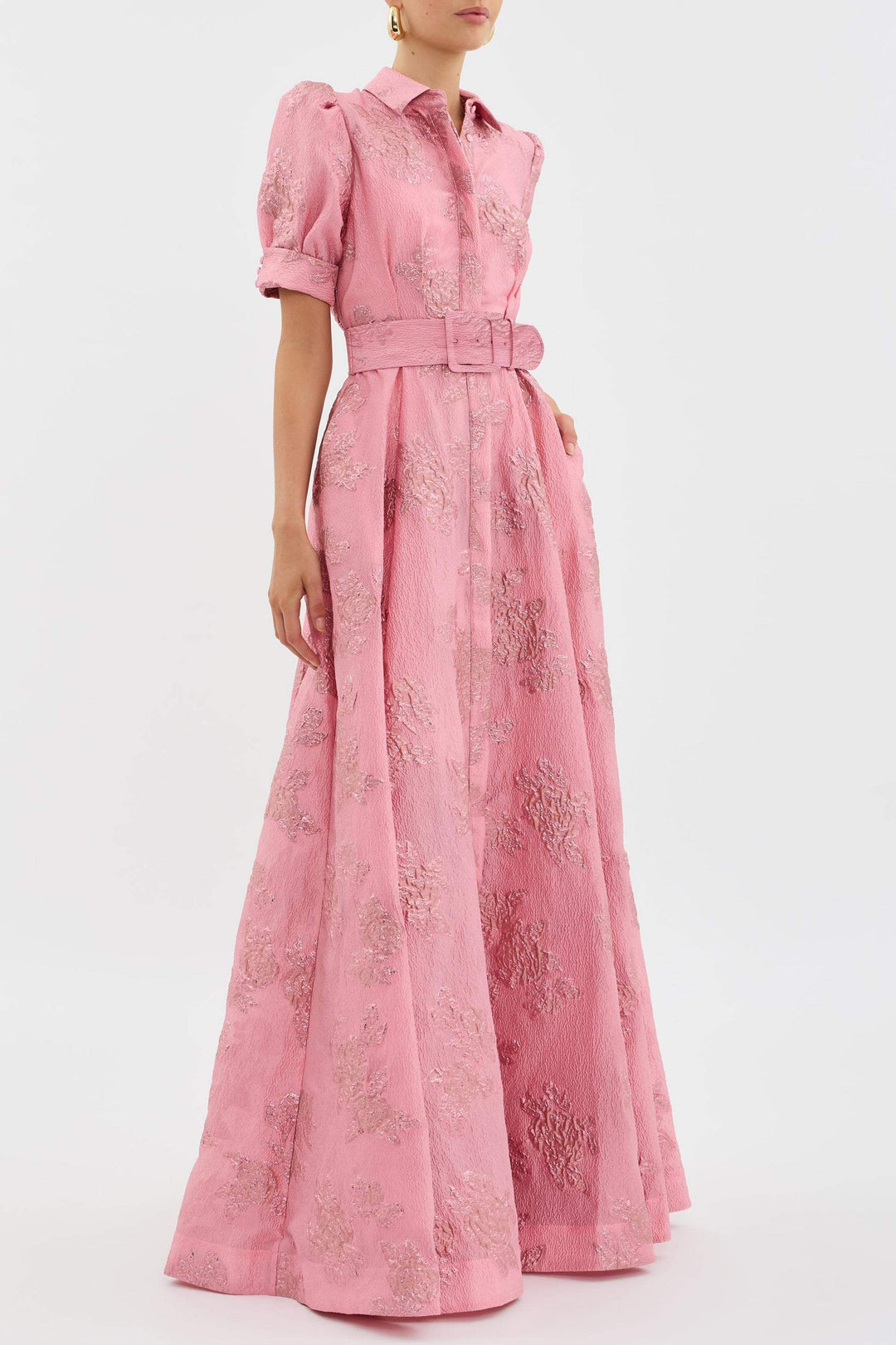 Female model wearing a soft pink high waist dress with classic lapel detail.