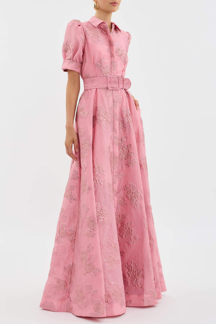 Female model wearing a soft pink high waist dress with classic lapel detail.