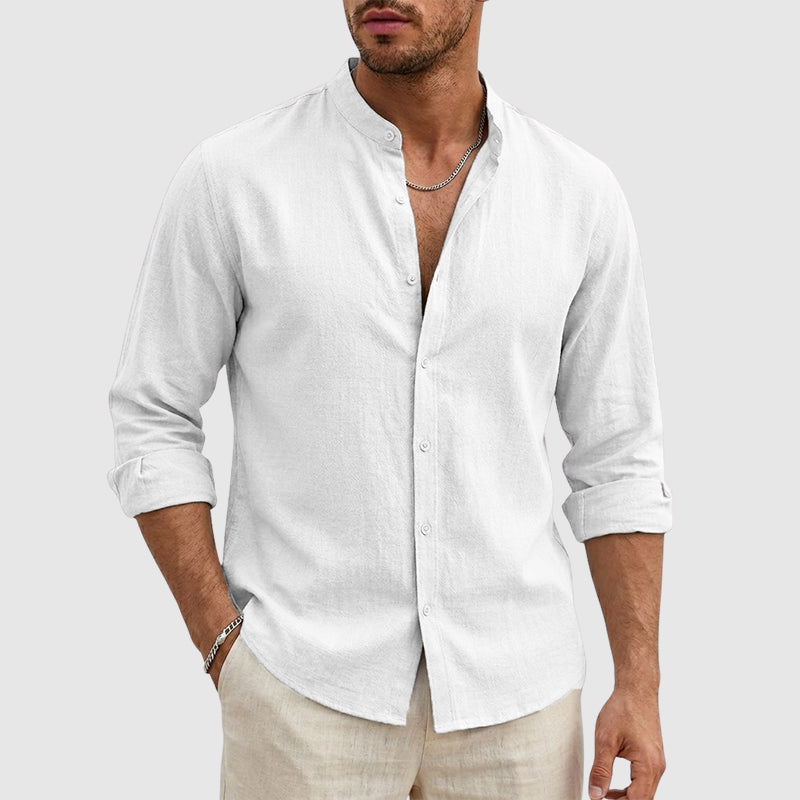  Female model posing in a relaxed-fit button-front shirt against a plain background.