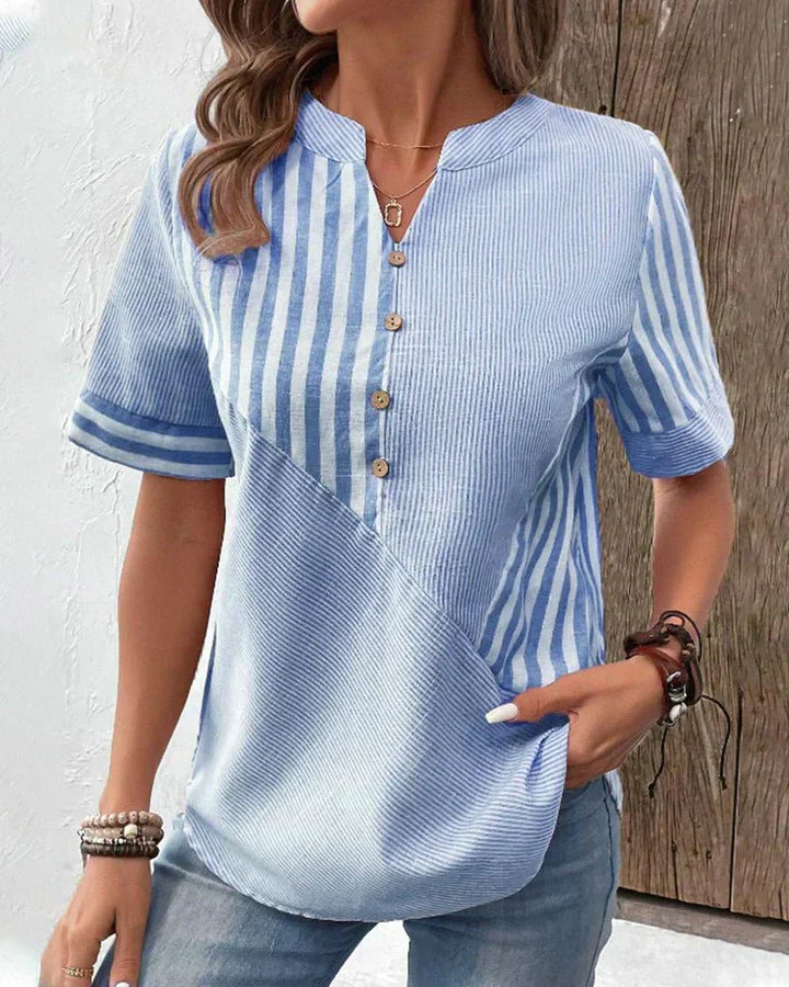 Classic striped women’s blouse displayed with a wearer and clean background.