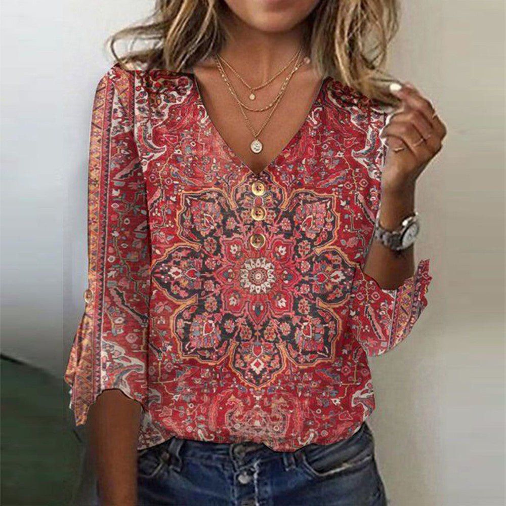 Front view of ruby patterned blouse on plain background.