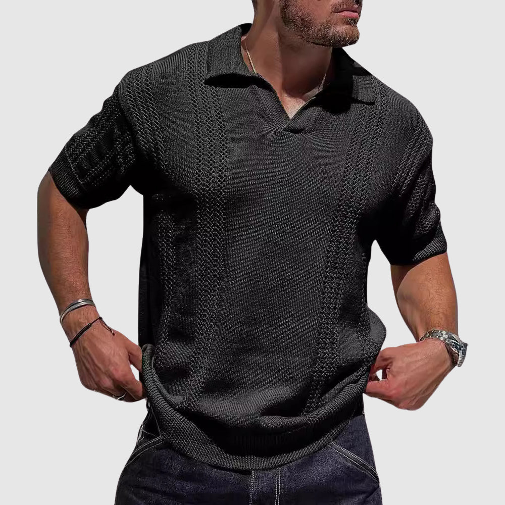 Male model wearing a textured open collar polo on a plain background